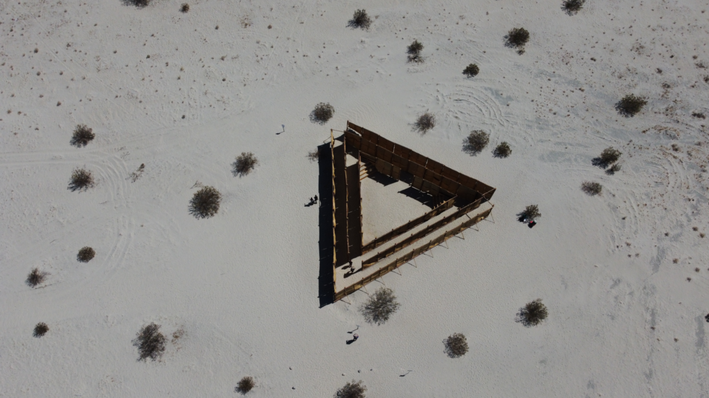 drone aerial photograph of art in desert 